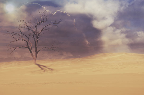 Dead tree in deserted sand dune under moody cloudy sky. Drought, climate change concepts and surreal landscape. Digital photo manipulation. Copy space for text.
