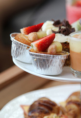 Strawberry fruit tart in aluminium foil cup.