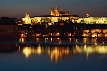 Fototapeta na wymiar incredible view of evening illuminated bridge and old city