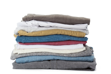 Stack of clothes on white background, closeup