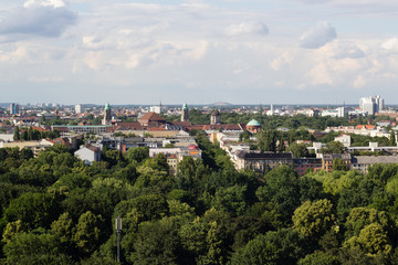 Fototapeta na wymiar Cityscape of Berlin and road in Tiergarten park landscape in cloudy day