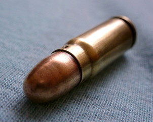 Fototapeta na wymiar Photo of an old cartridge on a piece of cloth