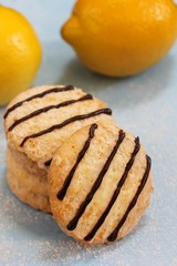 Lemon cookies on light  blue background, selective focus