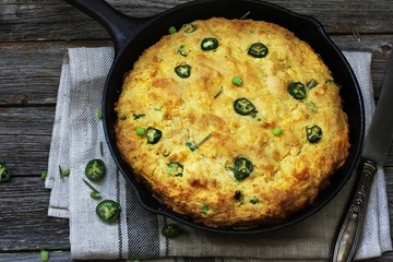 Skillet Jalapeno Cornbread on dark wooden background