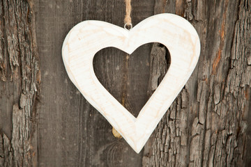 White heart on rustic wooden background