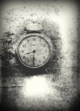 Old photo of the alarm clock - grained, scratched, overexposure and underexposure, overall poor and non commercial