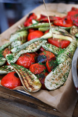 Eggplant and tomatoes cooked on barbecue grill