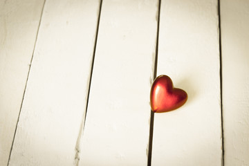 Red Heart on white wooden background, Love concept with minimalist and vintage style