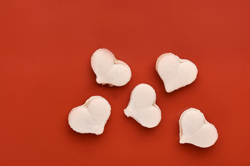 Cake macaron or macaroon on orange background