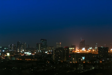 Clear blue sky as a background wallpaper with city scape at night