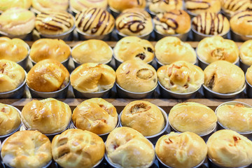 close up of plenty delicious thai sweet bread and cake with soy bean inside