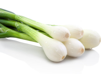 onions with water drops, isolated on white background with shadow reflection