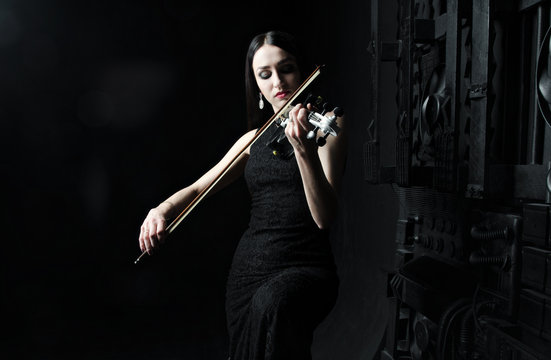 Beautiful woman playing the violin, art, emotions