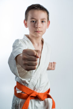 Karate, martial arts, a young guy blows, martial arts