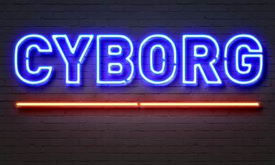 Cyborg neon sign on brick wall background.