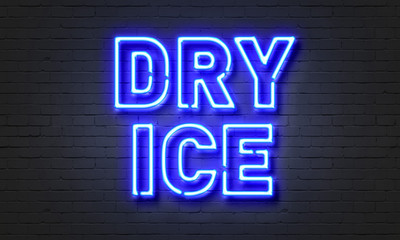 Dry ice neon sign on brick wall background.