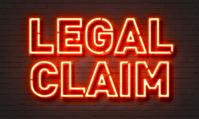 Fototapeta na wymiar Legal claim neon sign on brick wall background.
