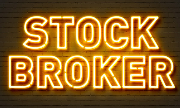 Stock Broker Neon Sign On Brick Wall Background.