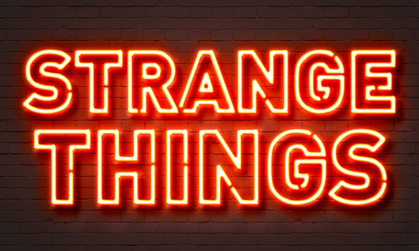 Strange Things Neon Sign On Brick Wall Background.