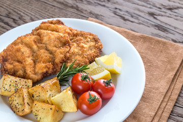 Portion of schnitzel with garnish