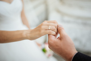 Wedding moments. Newly wed couple's hands with wedding rings