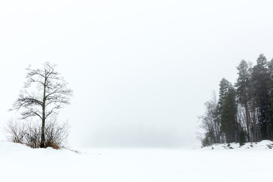 Foggy gap on frozen lake