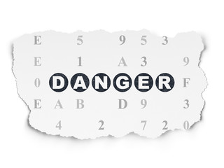 Security concept: Danger on Torn Paper background