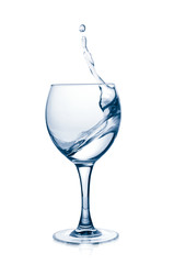 Glass with a splash clear water on white background