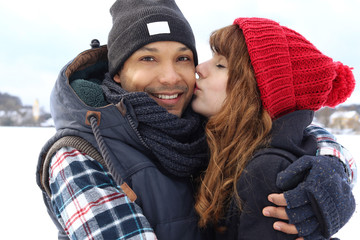 Loving couple kissing in winter outside © tiagozr