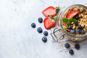 Homemade muesli granola with berries in a jar