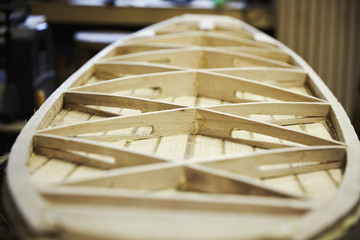 Wooden surfboard under construction, view of the interior struts.