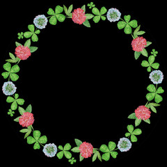 Watercolor floral wreath with green shamrock, white and pink clover hand drawn illustration on black background 