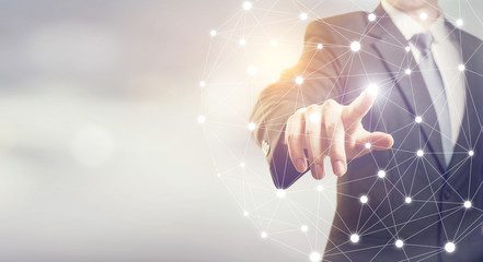 Closeup Businessman hand touching flying network, copy space