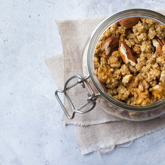 Homemade muesli granola with nuts in a jar