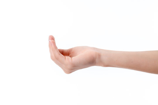 female hand outstretched to the side with bent hands isolated on white background