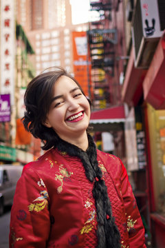 Young woman smiling in chinatown