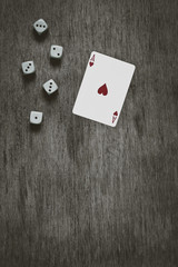 playing card ace of hearts and game dice background, vintage abstract, top view