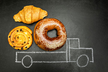 Painted truck with a load of baking in the back on a black background