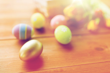 close up of colored easter eggs and flowers