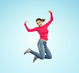 smiling young woman jumping in air