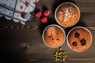 Obraz na płótnie Canvas Chocolate muffins in dark background
