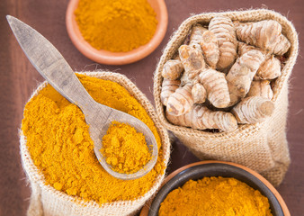 Roots and turmeric powder (Curcuma longa)