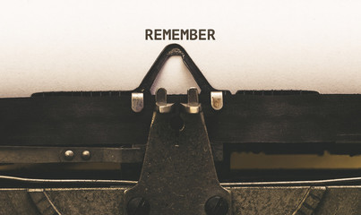 Remember, Text on paper in vintage type writer from 1920s - obrazy, fototapety, plakaty