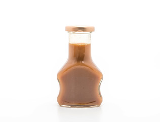 caramel bottle sauce on white