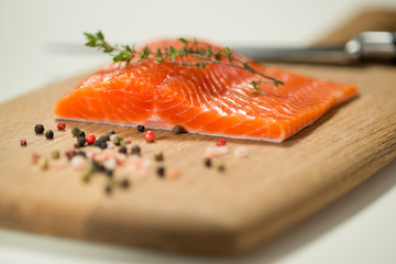 Fresh Trout Fillet with Herbs and Spices on Cutting Board