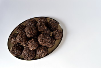 Homemade double chocolate oatmeal cookies on silver platter