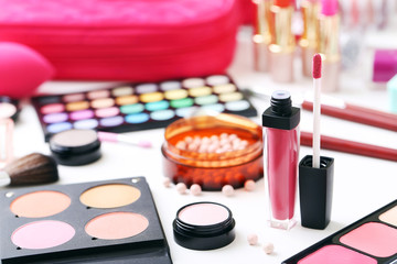 Obraz na płótnie Canvas Different makeup cosmetics on white table