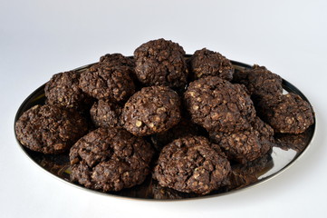 Homemade double chocolate oatmeal cookies on silver platter