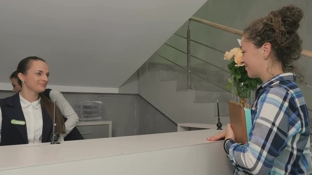 Two hostesses services a beautiful girl