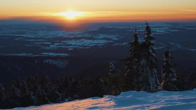 Winter gold sunset from the mountain in great weather with airplanes crossing the horizon